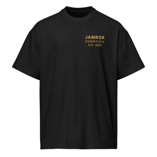 Studio shot of JamRok Essentials Drop 002 Men’s Boxy Tee in premium heavyweight cotton, highlighting the relaxed fit and reinforced ribbed neckline for Caribbean streetwear fashion.